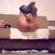 A girl lies on her back with her ass over the edge of a sofa while taking a hard, chunky shit onto a plate on the floor. A slight amount of piss comes out as well. Presented in 720P HD, although video is somewhat dark and grainy.  Over 2 minutes.